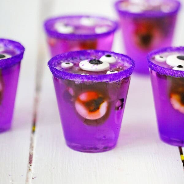 Creepy Monster Jello Shots on a white table.