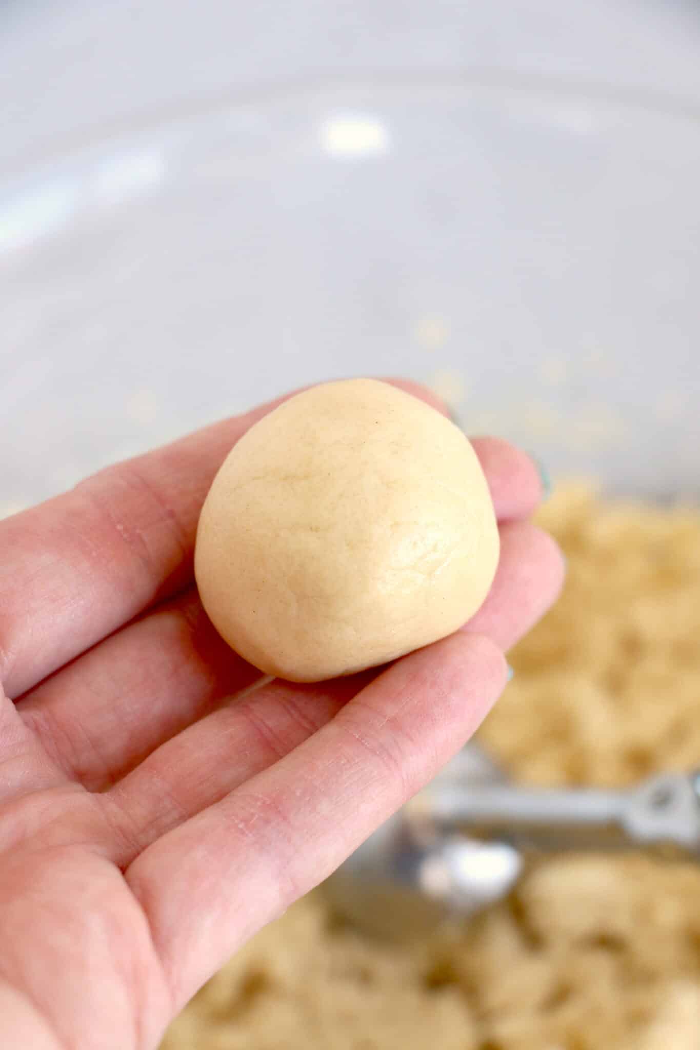 Rolling the dough balls.