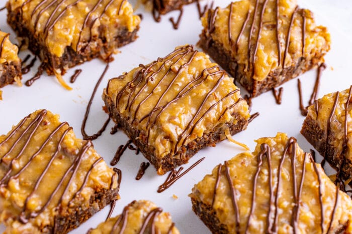 German Chocolate Brownies with chocolate drizzled on top.