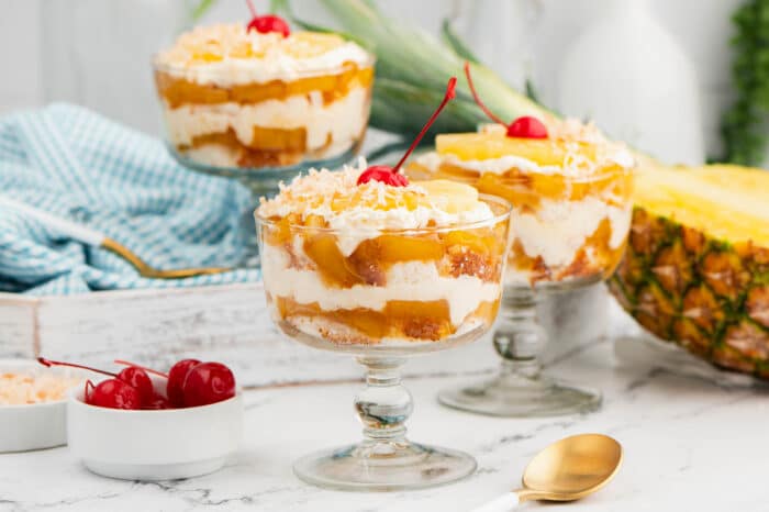 Three Pineapple Trifles in dishes.