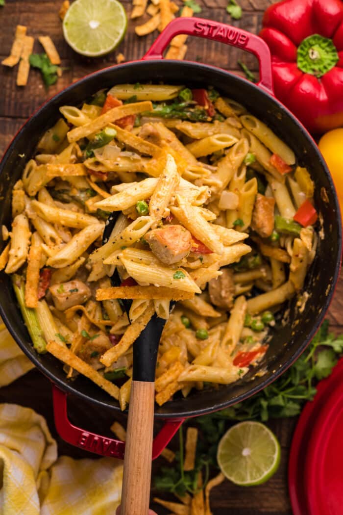 A spoon lifting up the Spicy Chicken Chipotle Pasta.
