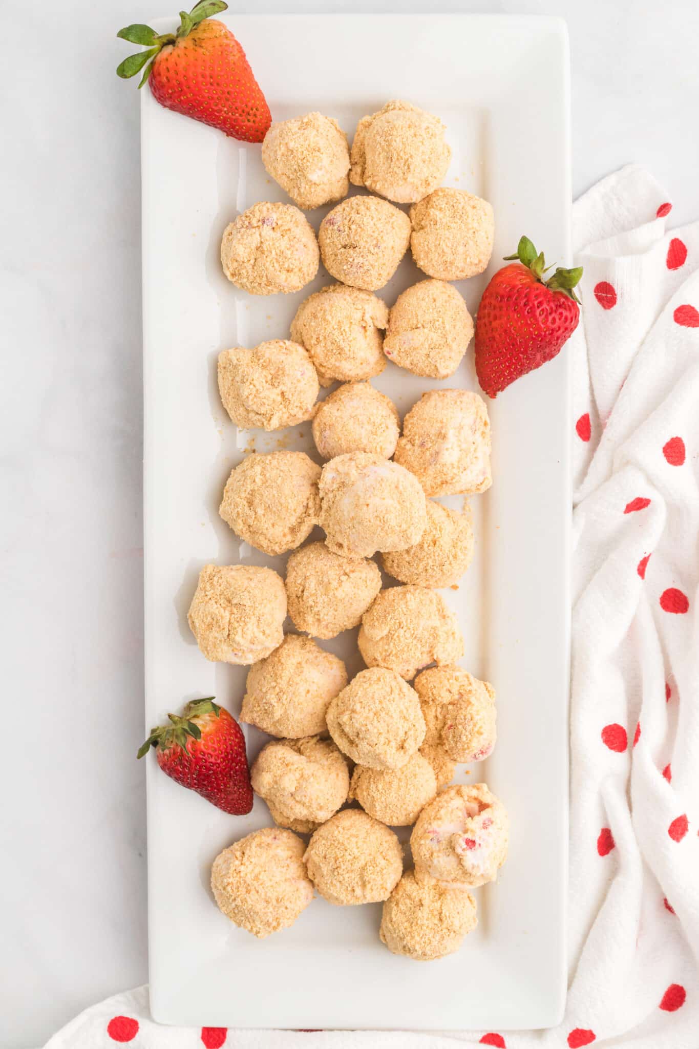 Strawberry Cheesecake Bites on a rectangle platter.