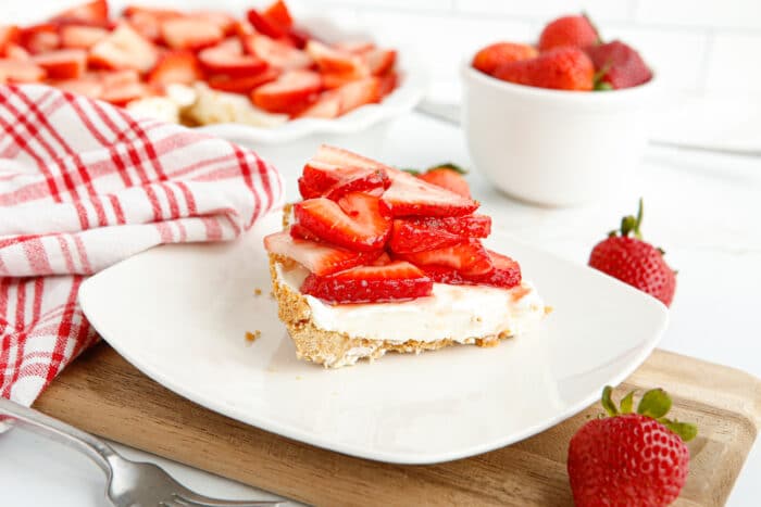 Strawberry Cream Cheese Pie on a wooden board.