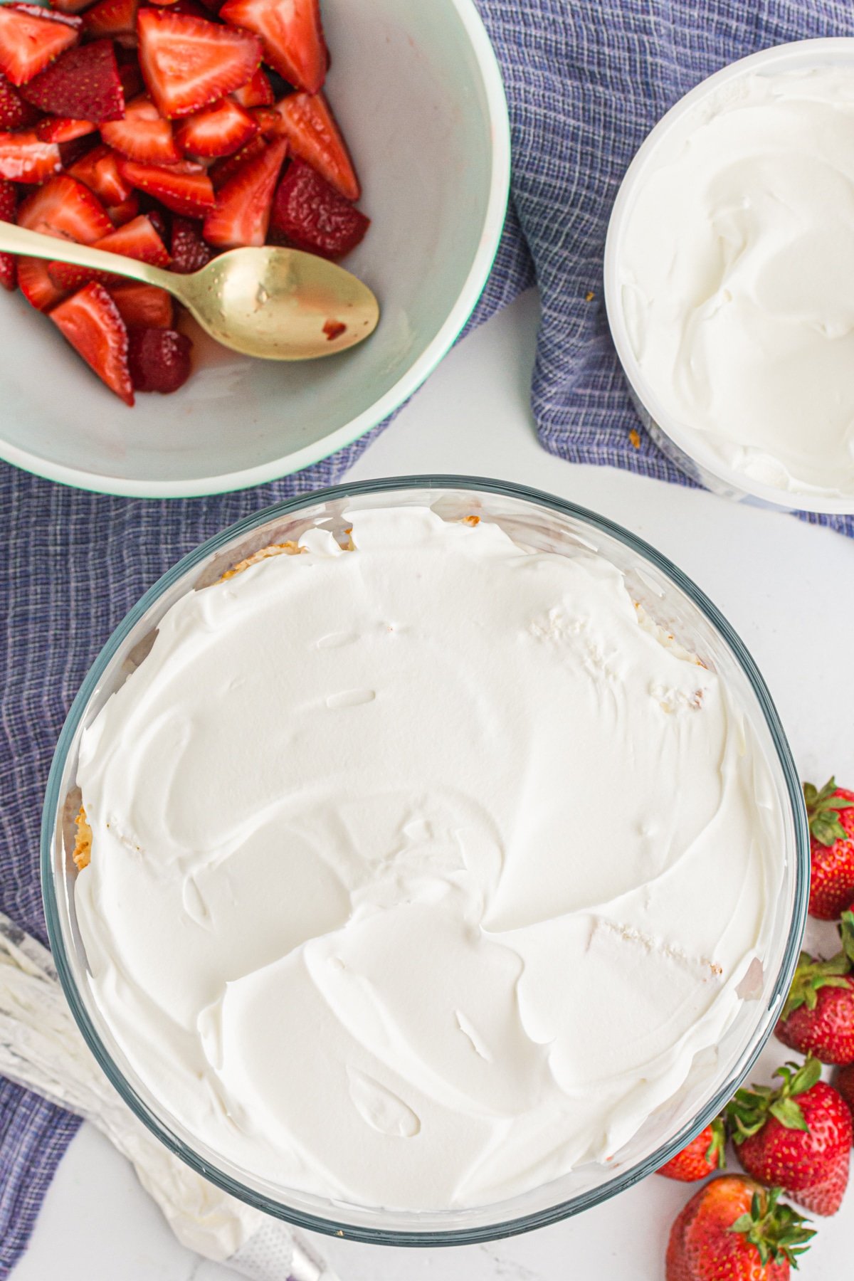 Layering with whipped cream.
