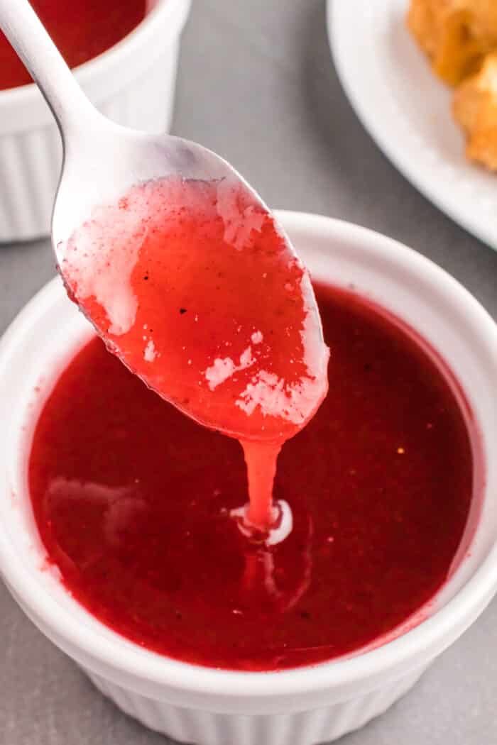 sweet and sour sauce over a spoon