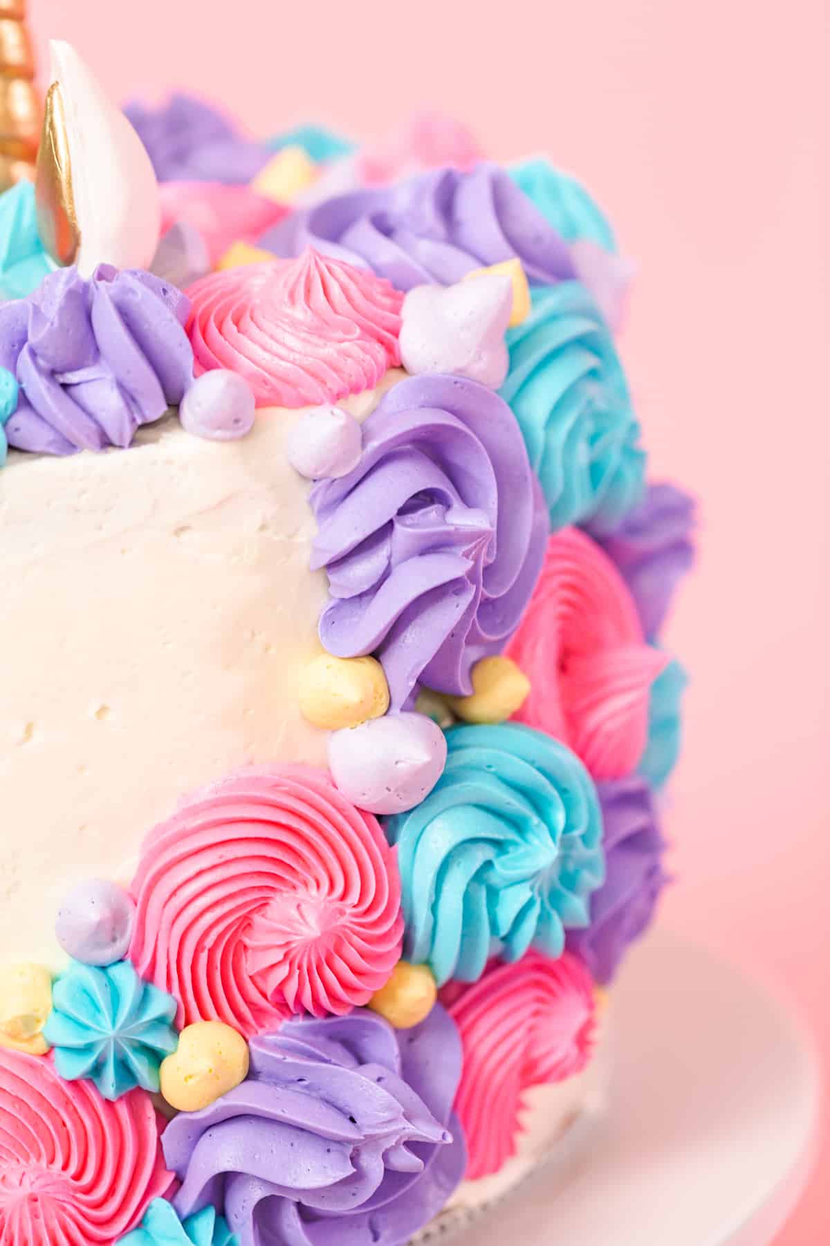 Close-up of the buttercream mane on a unicorn layer cake