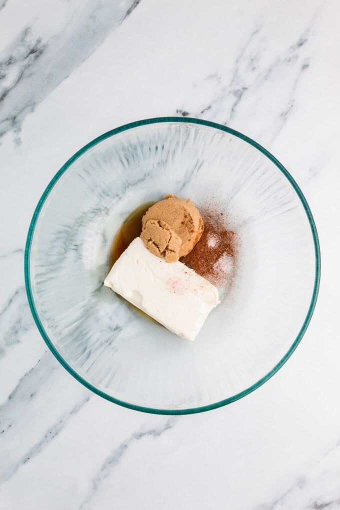 Ready in 5 minutes, this Caramel Apple Dip is made with cream cheese, brown sugar, and caramel sauce for an easy fall treat. Cream cheese, browns sugar, and cinnamon in a bowl