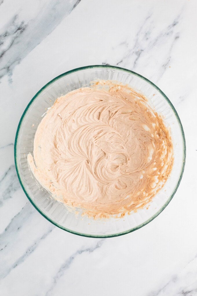 Ready in 5 minutes, this Caramel Apple Dip is made with cream cheese, brown sugar, and caramel sauce for an easy fall treat. Cream cheese caramel apple dip in a mixing bowl