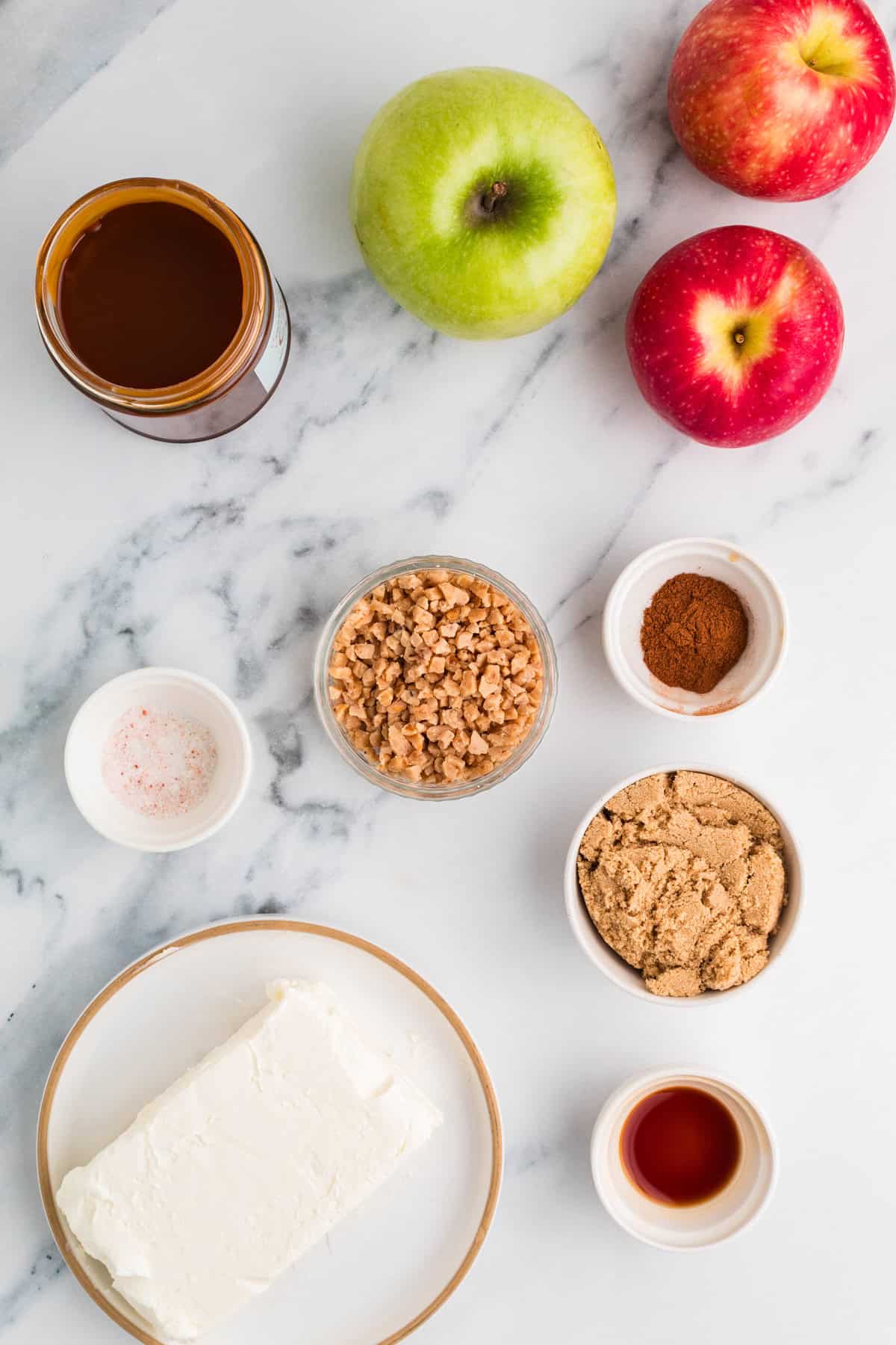 Ready in 5 minutes, this Caramel Apple Dip is made with cream cheese, brown sugar, and caramel sauce for an easy fall treat. Overhead view of ingredients needed to make caramel apple dip