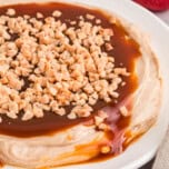Close side view of a plate of caramel apple dip