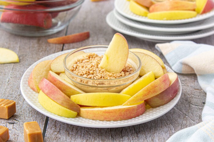 Caramel Apple Dip with an apple slice in it.