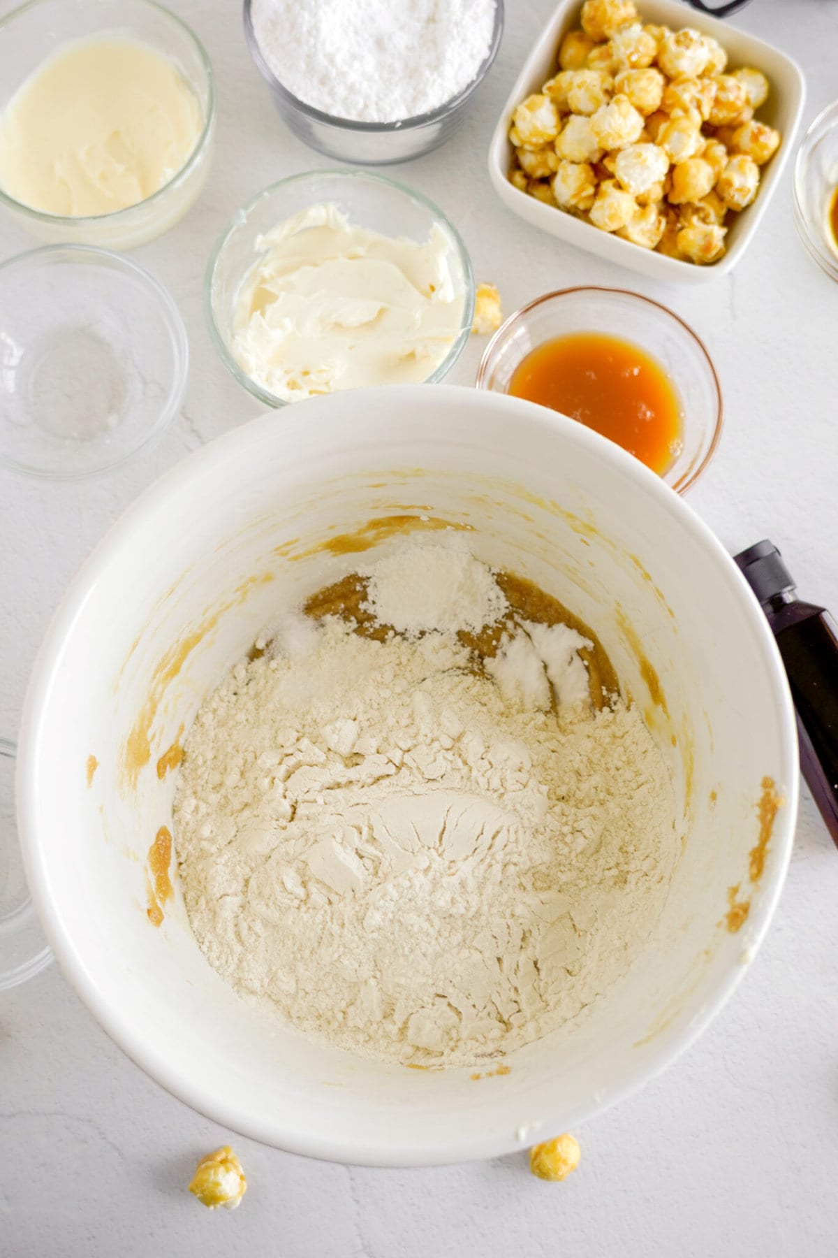 Adding the flour to the batter.