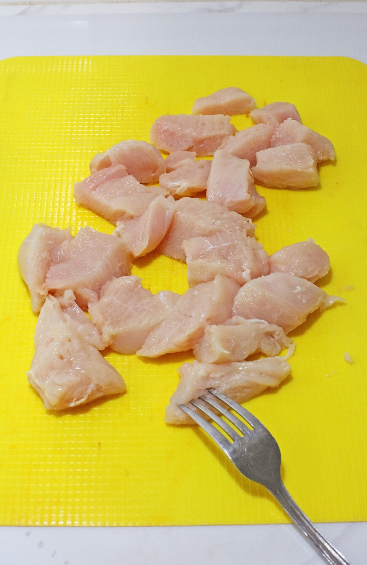 Cutting the chicken.