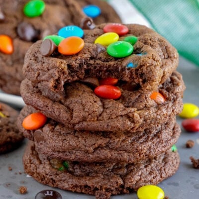 Chocolate M&M Cookies stacked on top of each other.