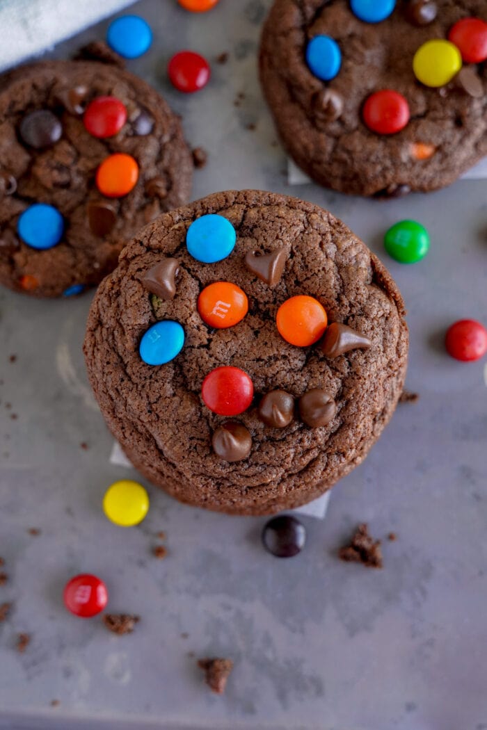 Chocolate M&M Cookies on a grey slate.