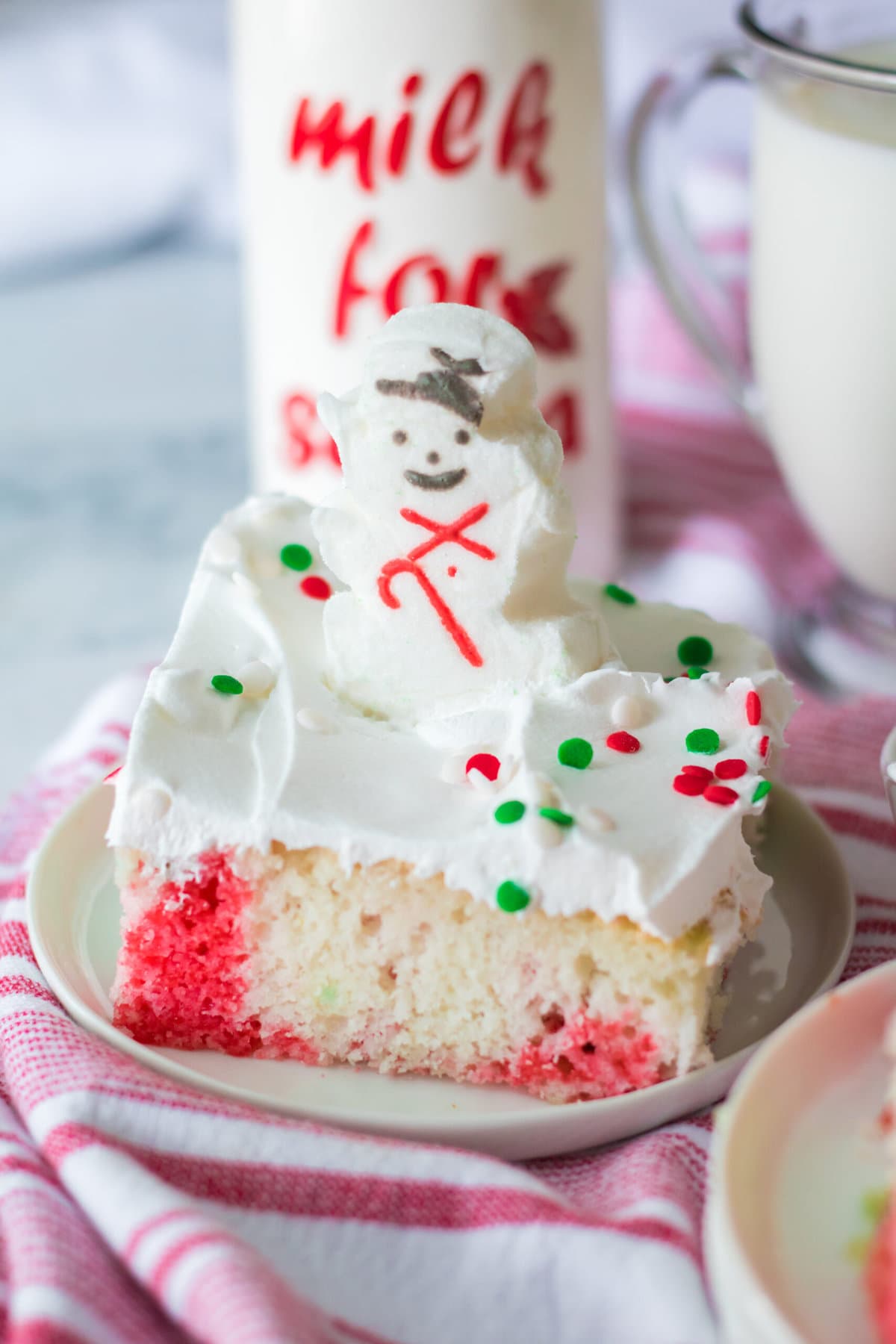 Christmas Poke Cake with a snowman peep.