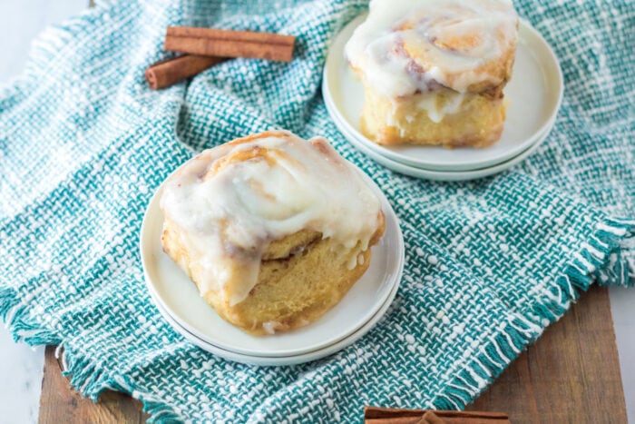 Cinnamon Rolls with Heavy Cream with icing on top.