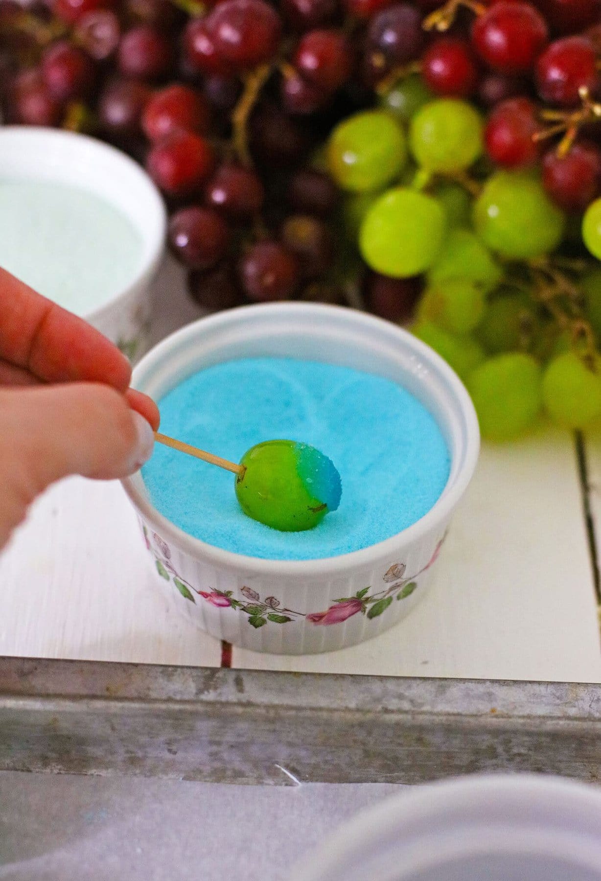 Dipping the grapes in jello.