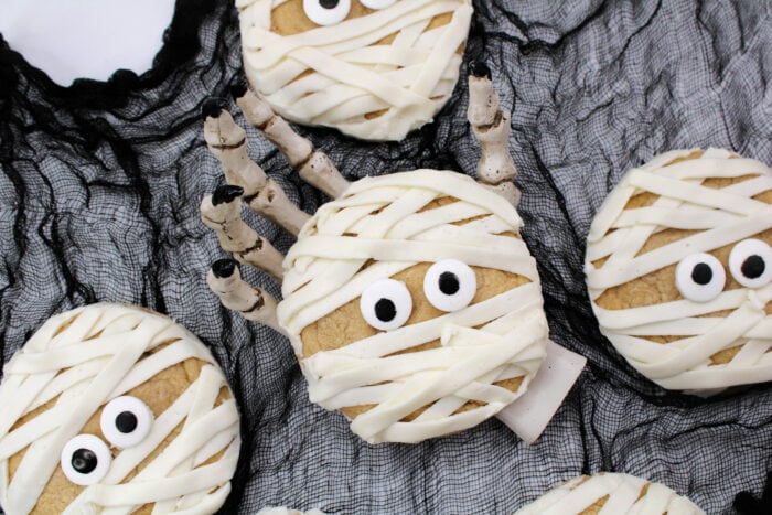Mummy Cookies in a skeleton hand.