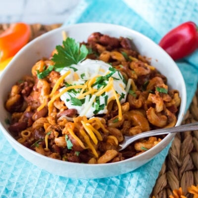 Slow Cooker Chili Mac with sour cream on top.