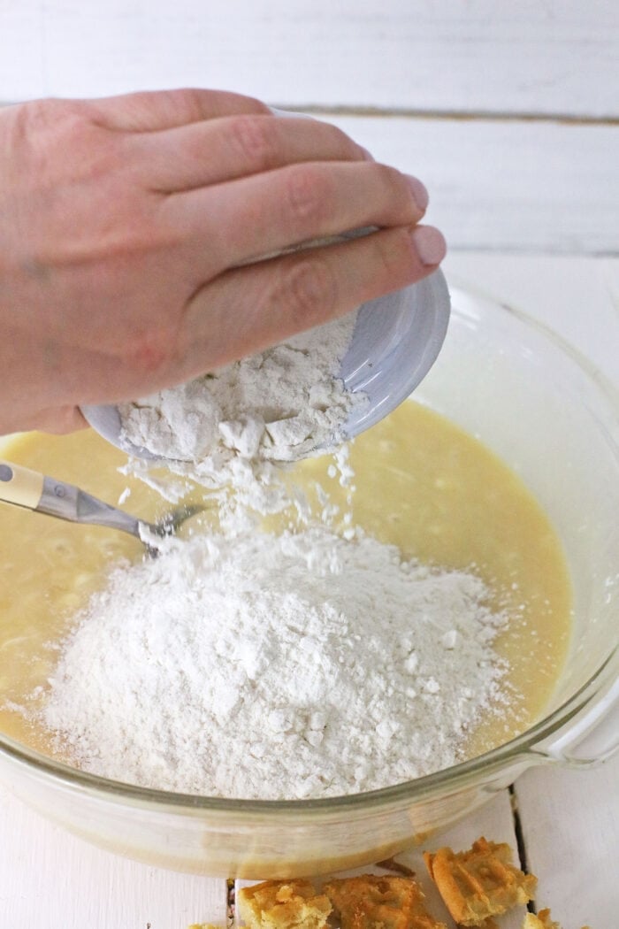 Adding the flour into the fudge batter.