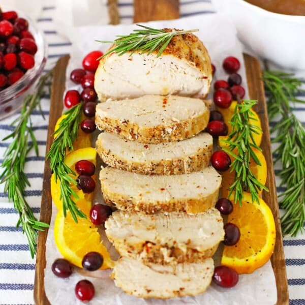 cooked cranberry orange turkey on a wood block
