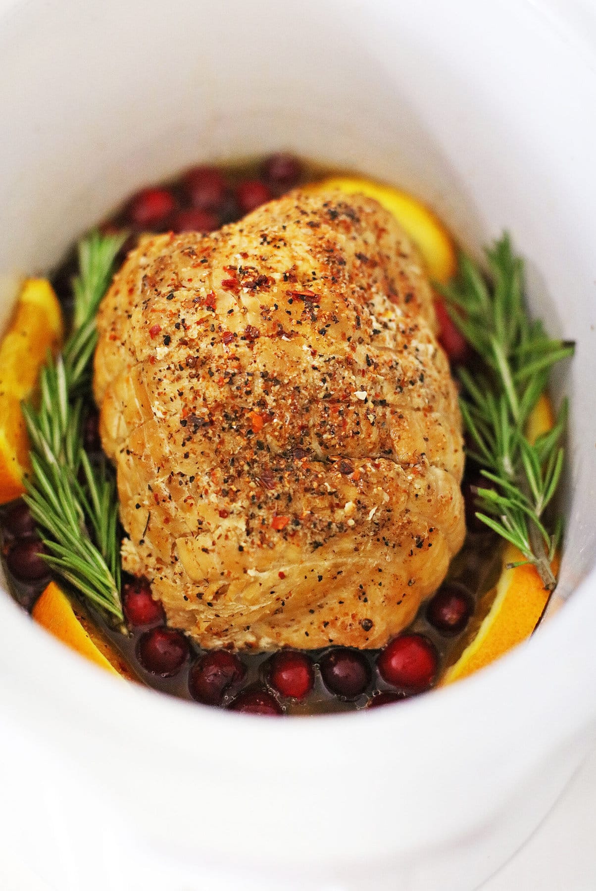 cooked cranberry orange turkey in a slow cooker