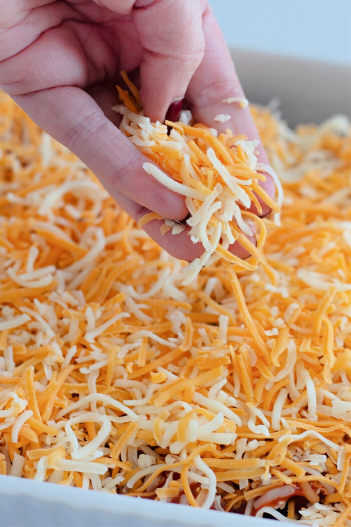 sprinkling cheese over top.