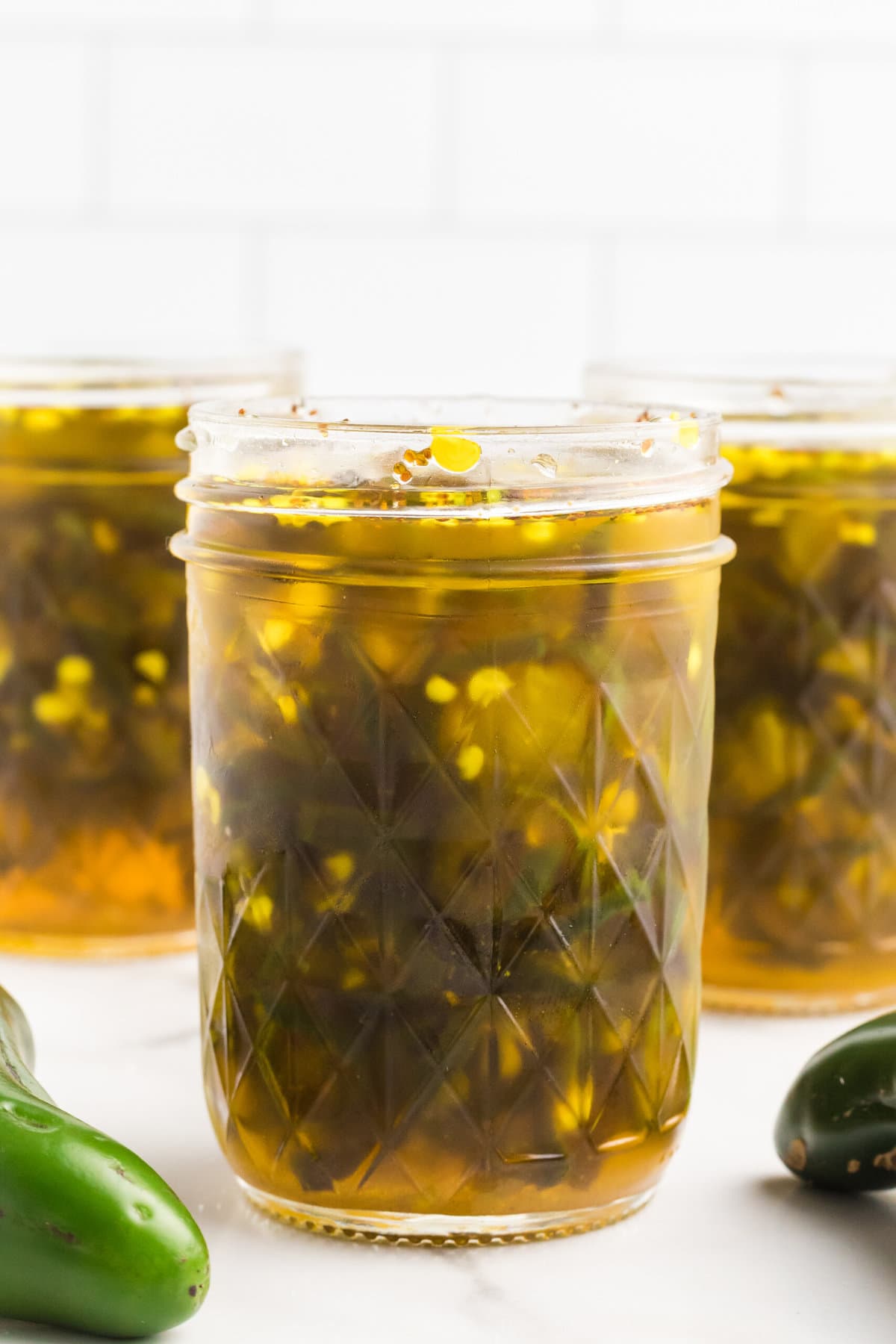 Candied Jalapenos in jars.