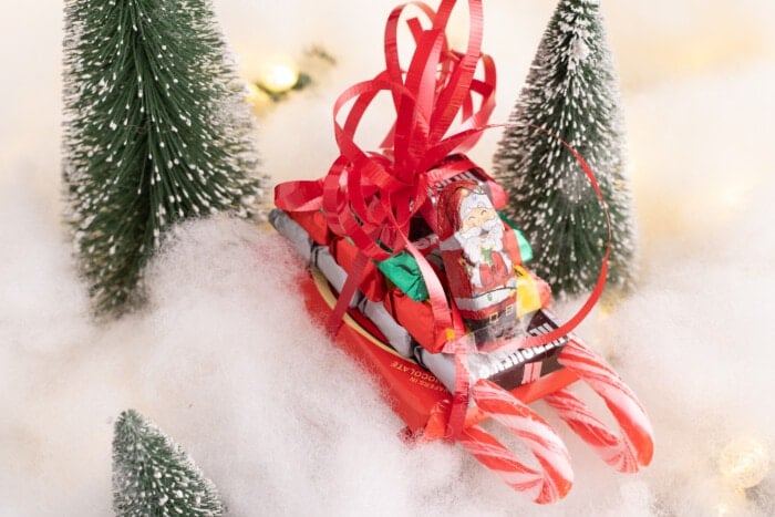 Candy Sleighs For Christmas on a snow covered ground.