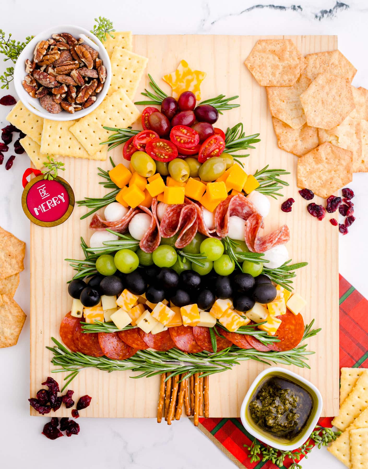 Christmas Tree Charcuterie Board with crackers on the side.