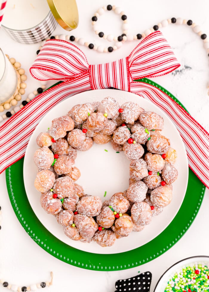 Christmas Donut Wreath on a white platter.