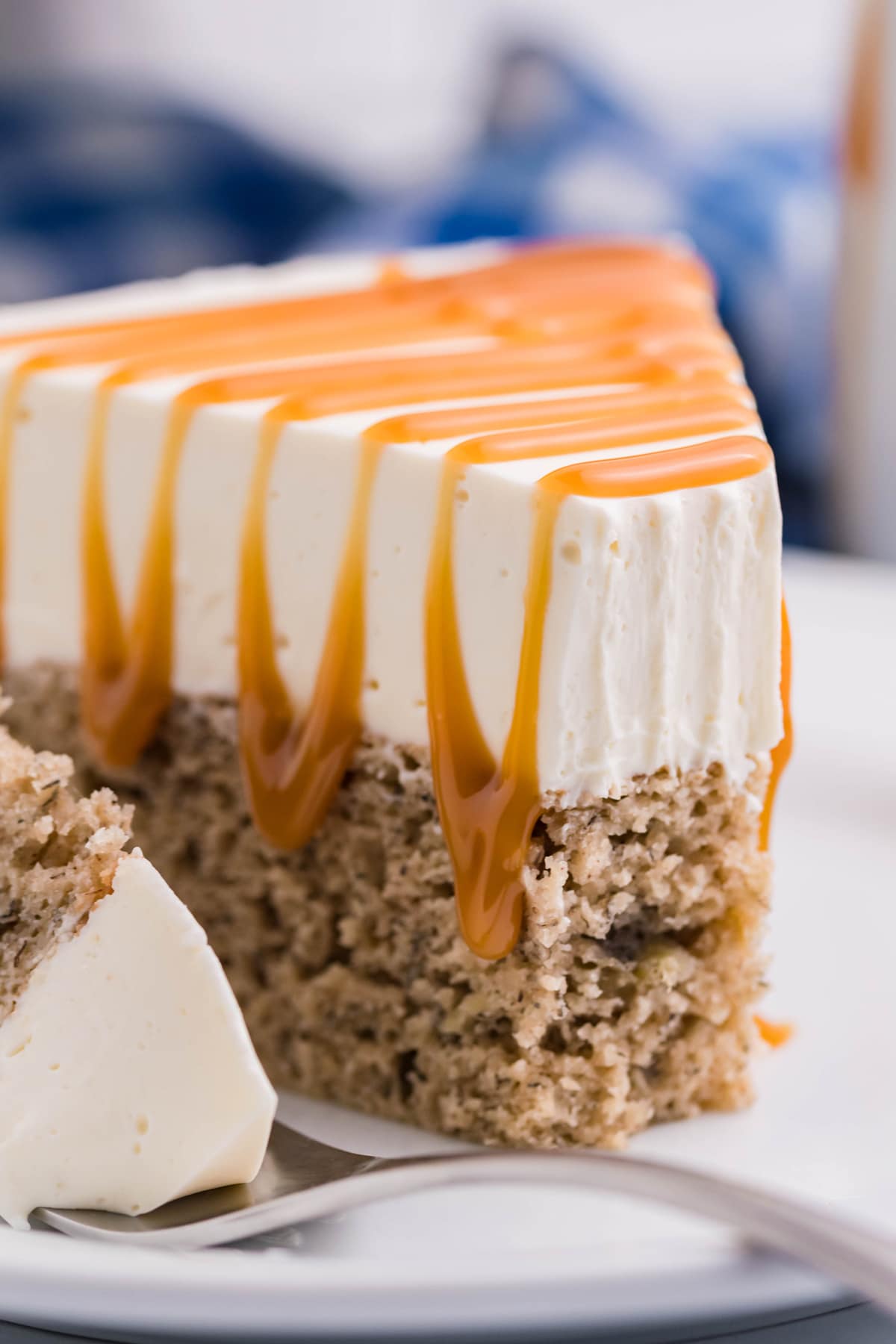 A slice of banana bread cheesecake topped with caramel sauce