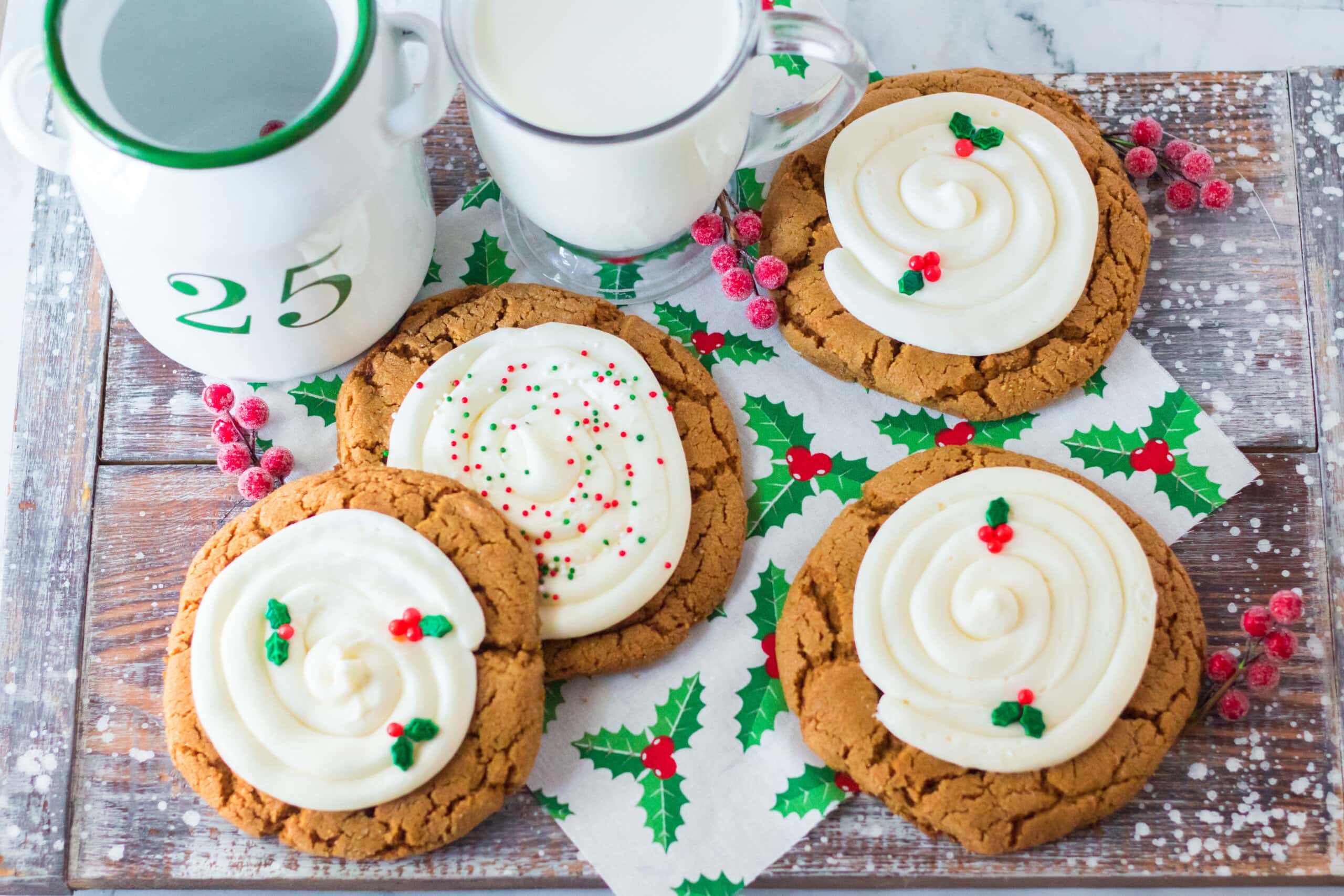 Gingerbread Cookies with frosting on a table cloth.