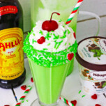Grinch Milkshake with a festive straw.