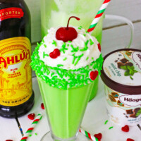Grinch Milkshake with a festive straw.