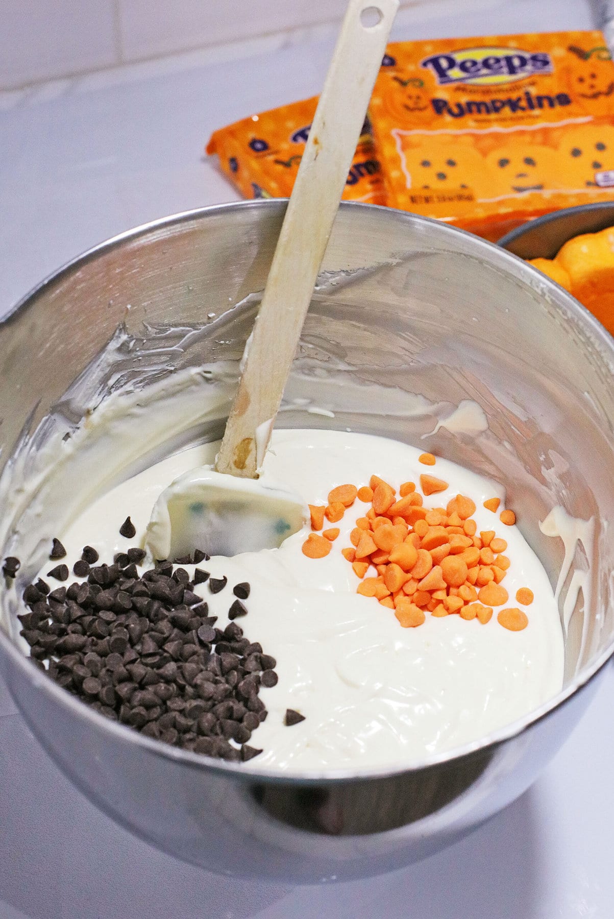 Adding the chocolate chips into the batter.