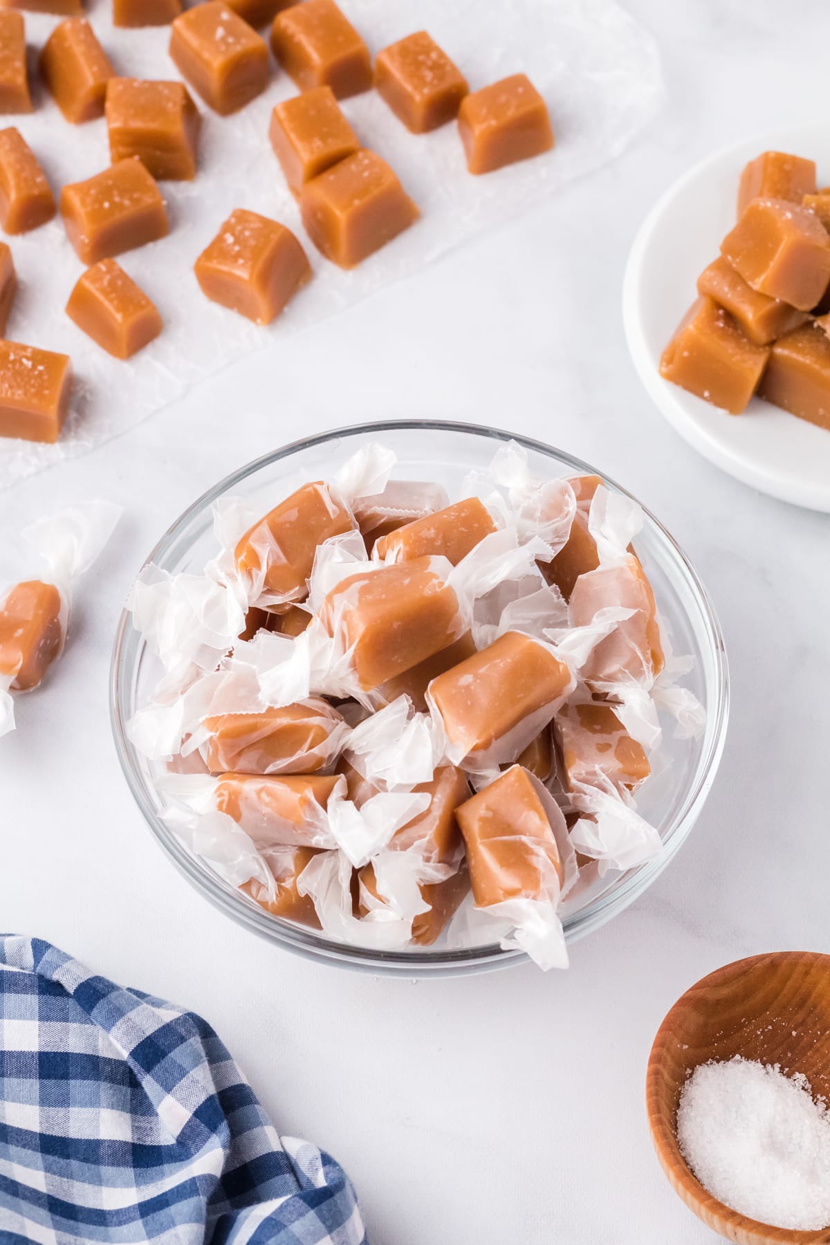 Overhead view of caramel candy in a glass bowl