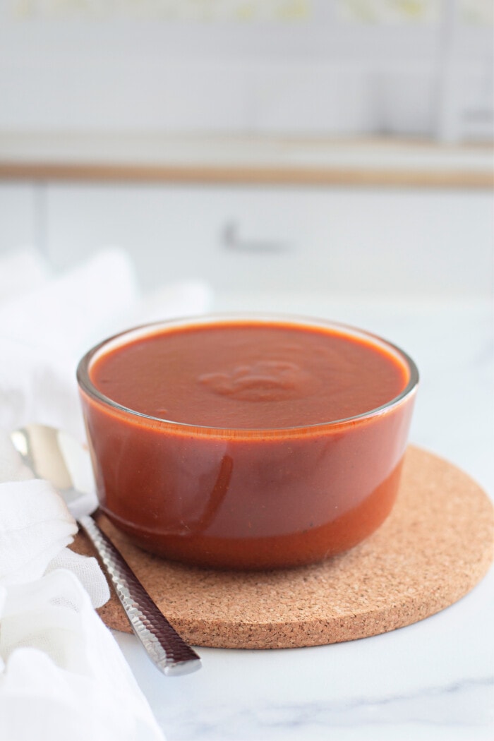 Homemade Enchilada Sauce in a clear glass bowl.