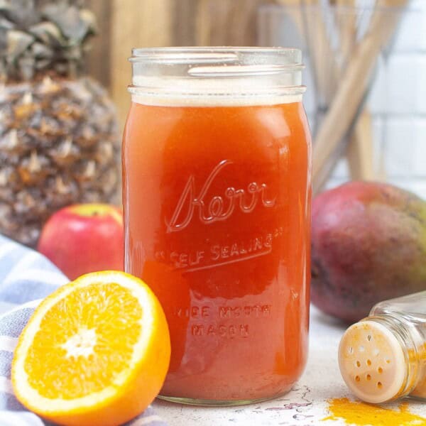Immunity Booster Drink with a cut orange on the side.