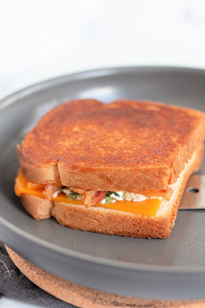 pan-frying the grilled cheese sandwich.