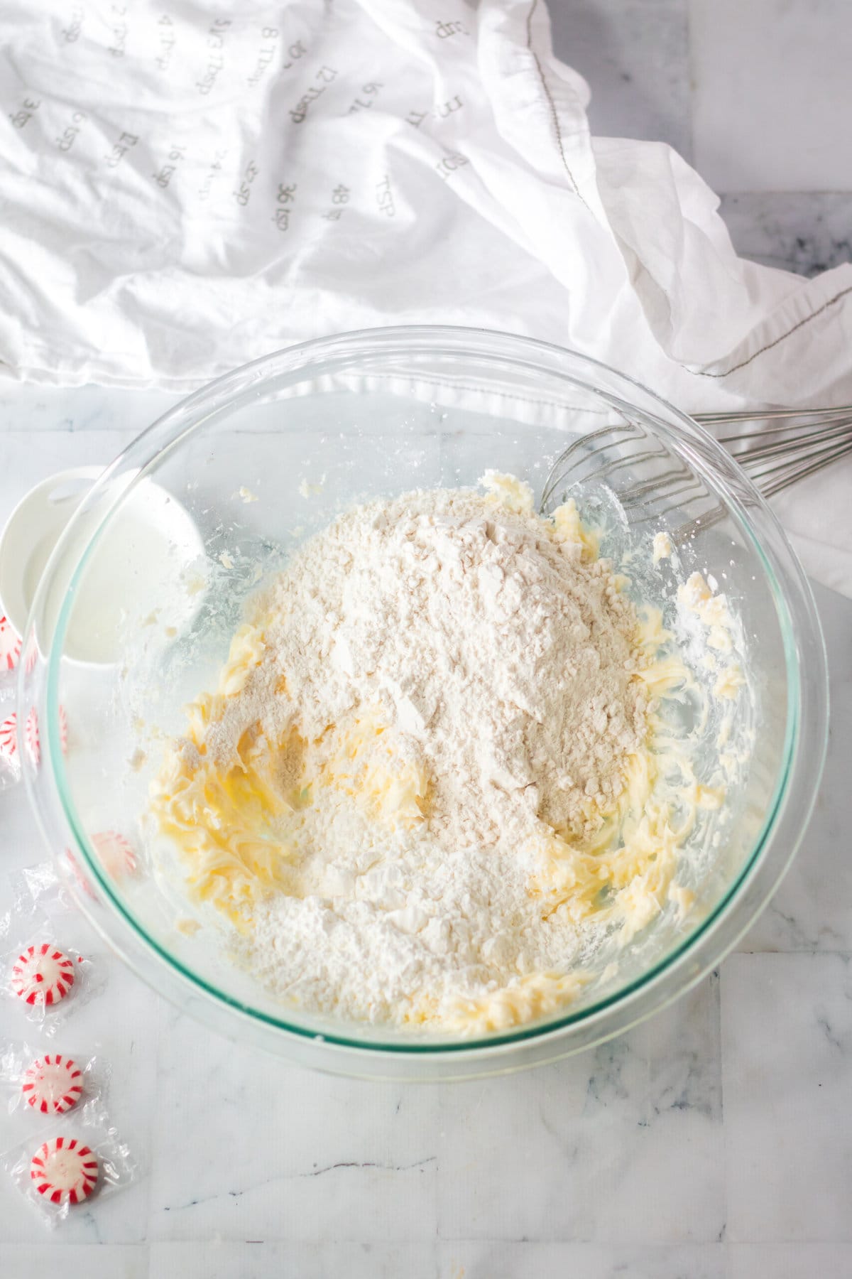 Adding the flour to the mixture.
