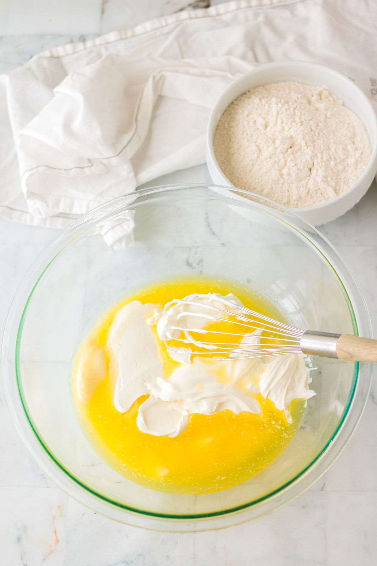 Mixing the butter and sour cream.