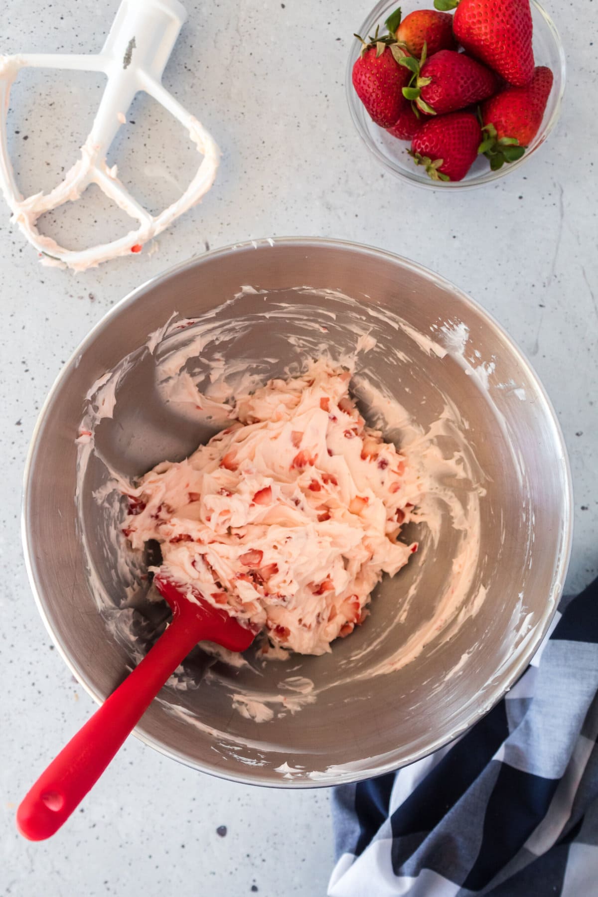 Mixing in the strawberries.