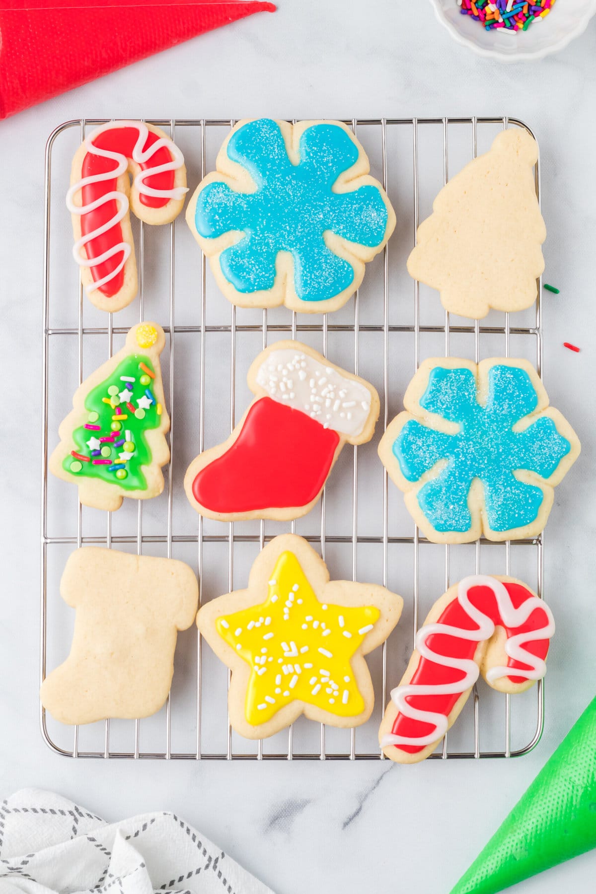 The decorated cookies on a rack.