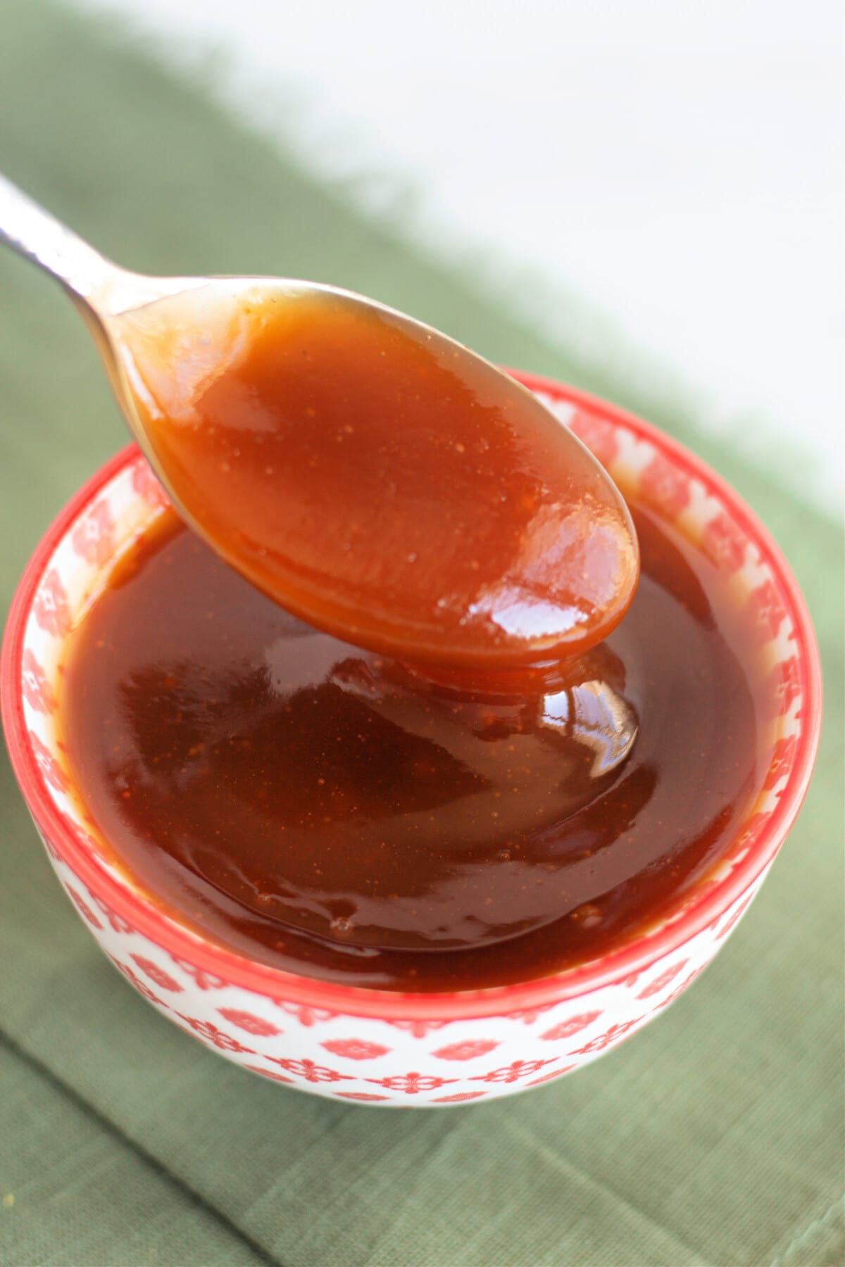 Sweet and Sour Sauce in a bowl with a spoon