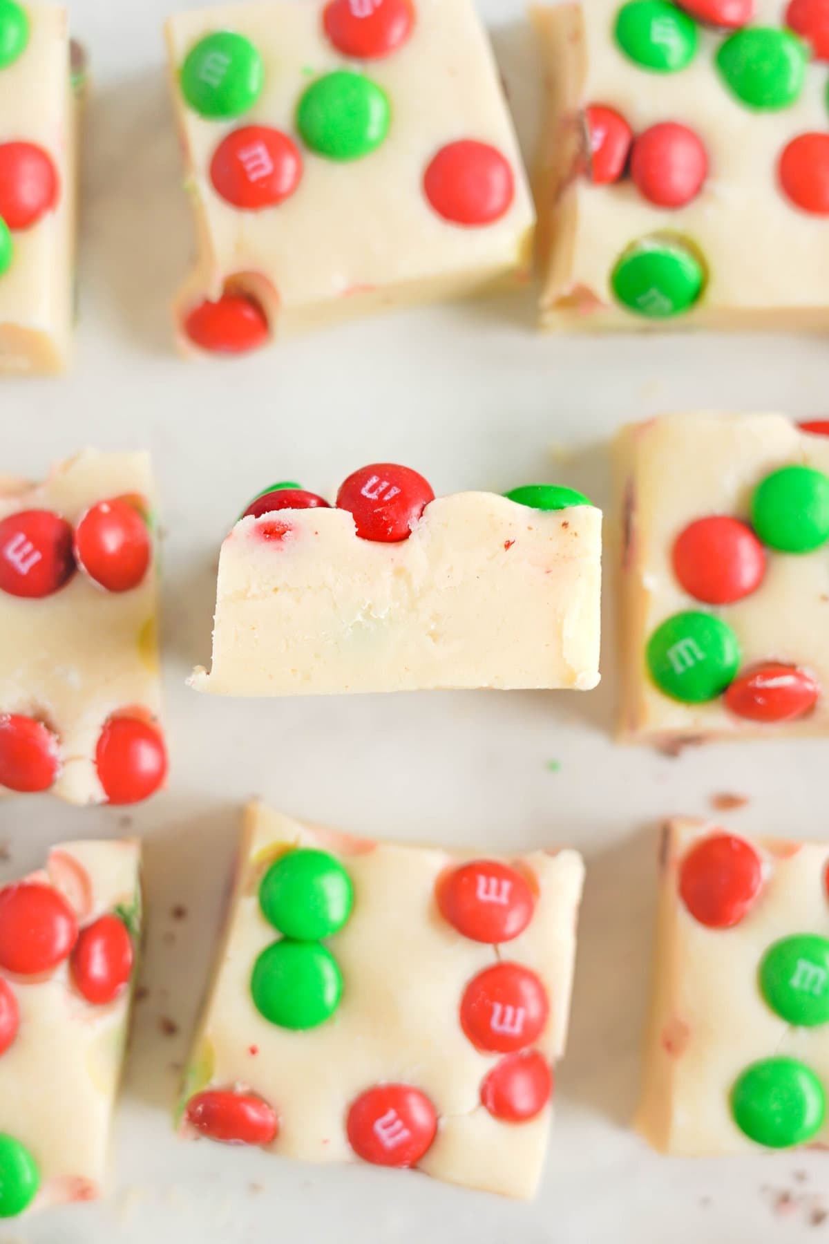 White Chocolate Christmas Fudge on parchment paper.