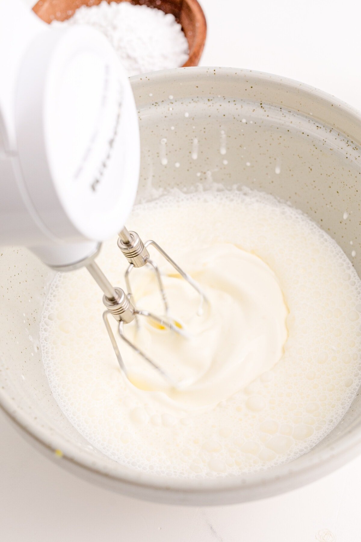 beating heaving cream with a hand mixer