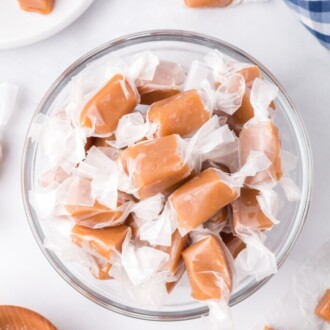 Overhead view of a bowl of wrapped caramels