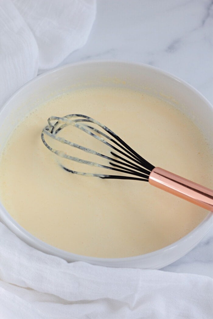 mixing cream with a whisk
